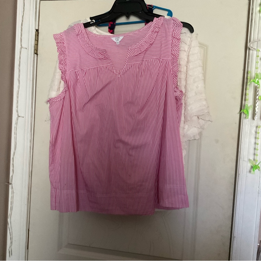 This is a pink off cut sleeve shirt